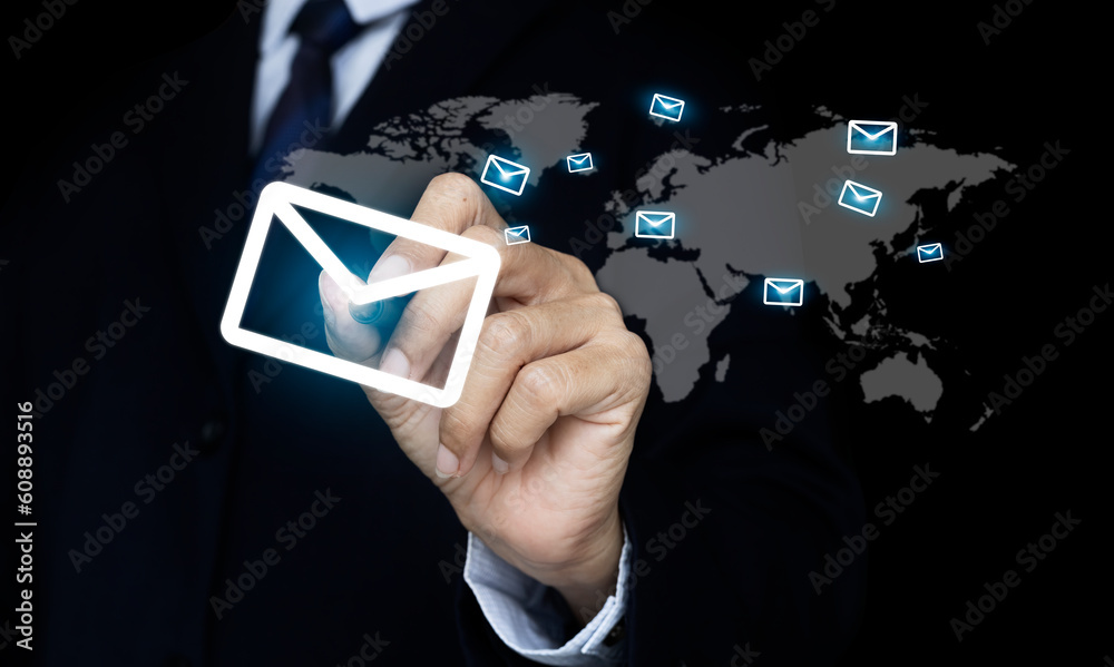 Hand pen pressing an envelope that is sent mail to the world. e-mail and marketing concept Hand pen pressing an envelope that is sent mail to the world. e-mail and marketing concept
