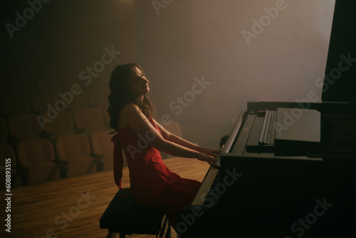 Wall Mural The woman plays the piano