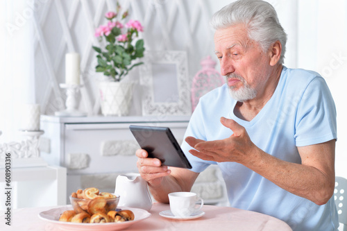 senior man using tablet