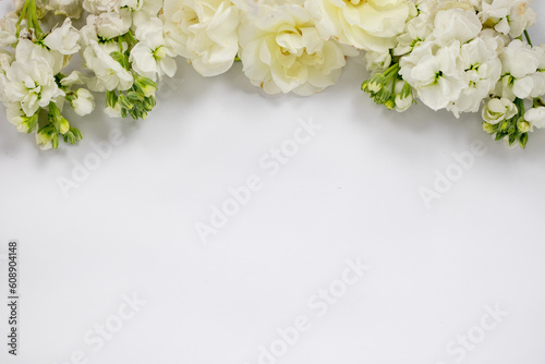 White Bridal Floral Border of wild roses and small flowers on white background 