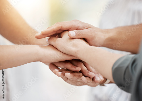Collaboration, support and business people with a pile of hands in a huddle as a team for community, solidarity or unity. Teamwork, trust or motivation with a group of colleagues standing in a circle