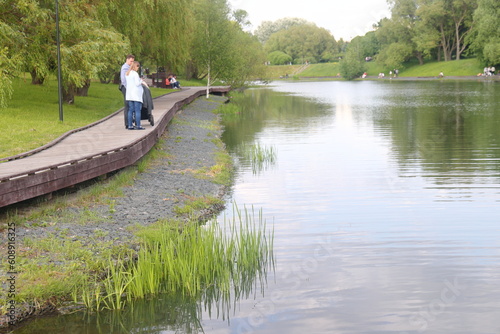 Photography Landscape with a river, trees and blue sky in the urban landscape park Yuzhnoye Butovo, Moscow, June 2023
