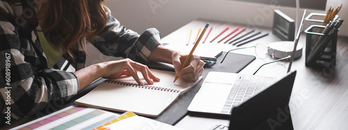 Graphic designer working with sketching logo design at office. Banner design