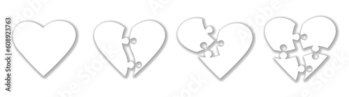 Set of heart shaped puzzle pieces. Puzzle jigsaw on white background. Symbol of Valentine's Day. Symbolic pieces of the autism puzzle. Vector illustration