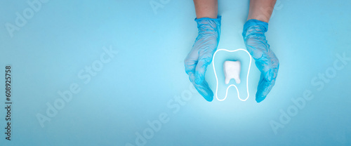 Female dentist hand in blue medical gloves holds tooth molar and Thin linear outline icon. Tooth symbol sign.
