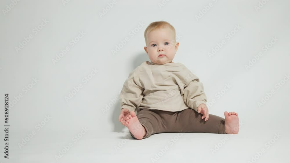 portrait of a smiling child, on a light studio background portrait of a smiling child, on a light studio background