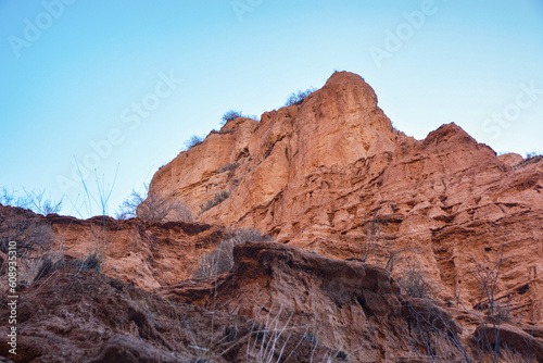 Beautiful view of cliffs from yellow red limestone. Kyrgyzstan.