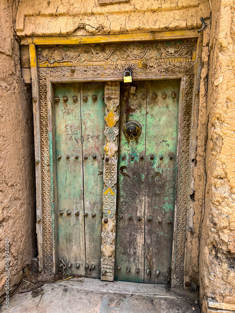 A carved door in a traditional Omani village Birkat Al Mouz near Nizwa