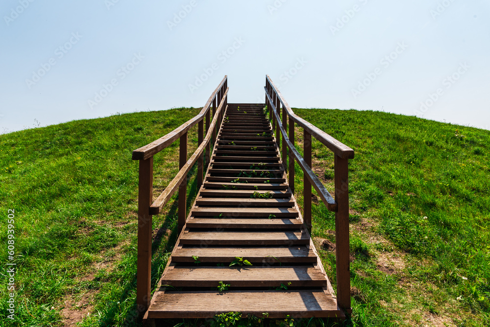 Stairs to heaven.Stairs into the future.wooden stairs at mountain.Summer day. Stairs to heaven.Stairs into the future.wooden stairs at mountain.Summer day.