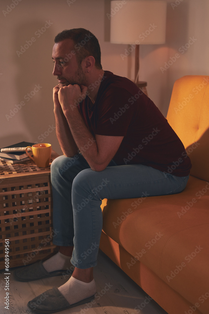 Bored man with lethargy and apathy sitting at home alone. Bored man with lethargy and apathy sitting at home alone.