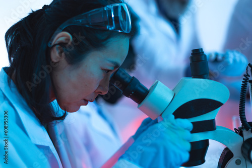 scientist performs analysis in the laboratory using the electron microscope