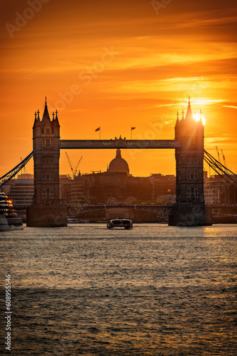 Photography Closeup view of the famous Tower Bridge in London, England during a colorful sun