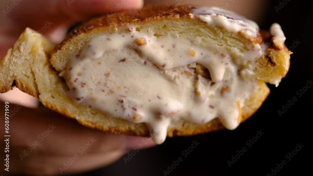A sweet and tasty treat, this sandwich features a scoop of creamy ice cream nestled between two slices of toasted bread. Perfect for a summertime snack or dessert, it's sure to satisfy any sweet tooth A sweet and tasty treat, this sandwich features a scoop of creamy ice cream nestled between two slices of toasted bread. Perfect for a summertime snack or dessert, it's sure to satisfy any sweet tooth