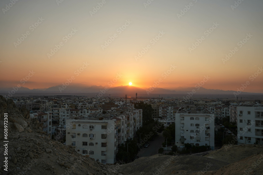 Fototapeta premium Sunset looking over an african city near the desert in Egypt
