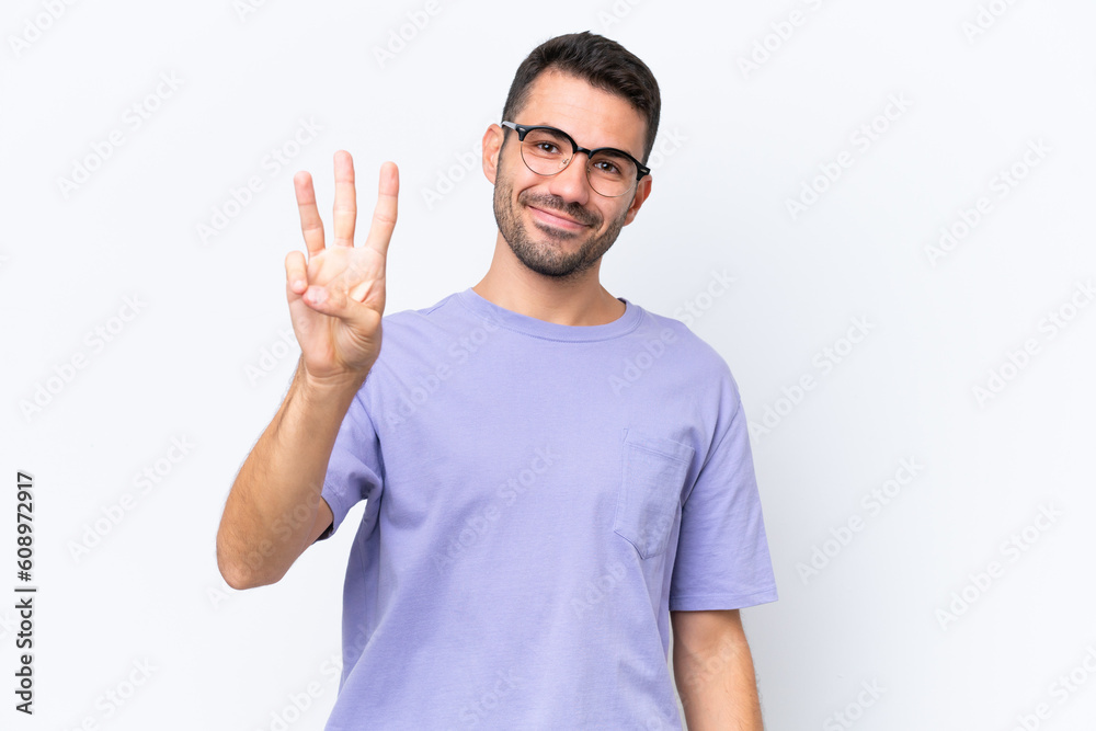 Young caucasian man isolated on white background happy and counting three with fingers Young caucasian man isolated on white background happy and counting three with fingers