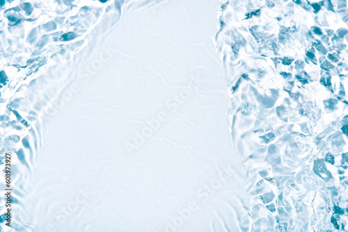 The texture of water on a white background in bright sunlight.