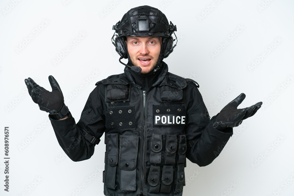 SWAT man over isolated white background with shocked facial expression SWAT man over isolated white background with shocked facial expression
