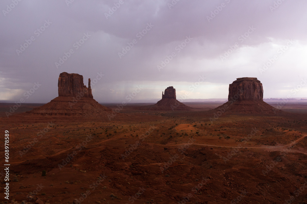 The Monument Valley Navajo Tribal Park in Arizona, USA. View of the West Mitten Butte, East Mitten Butte, and Merrick Butte Monuments.