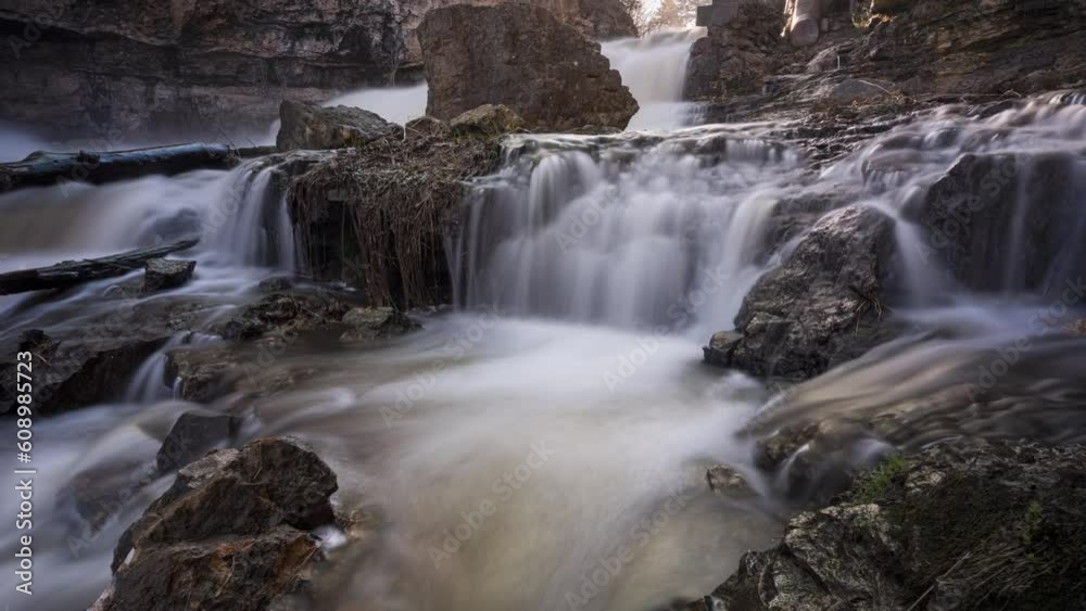 Timelapse of smooth rocky river stream waves flowing, lens flare Timelapse of smooth rocky river stream waves flowing, lens flare