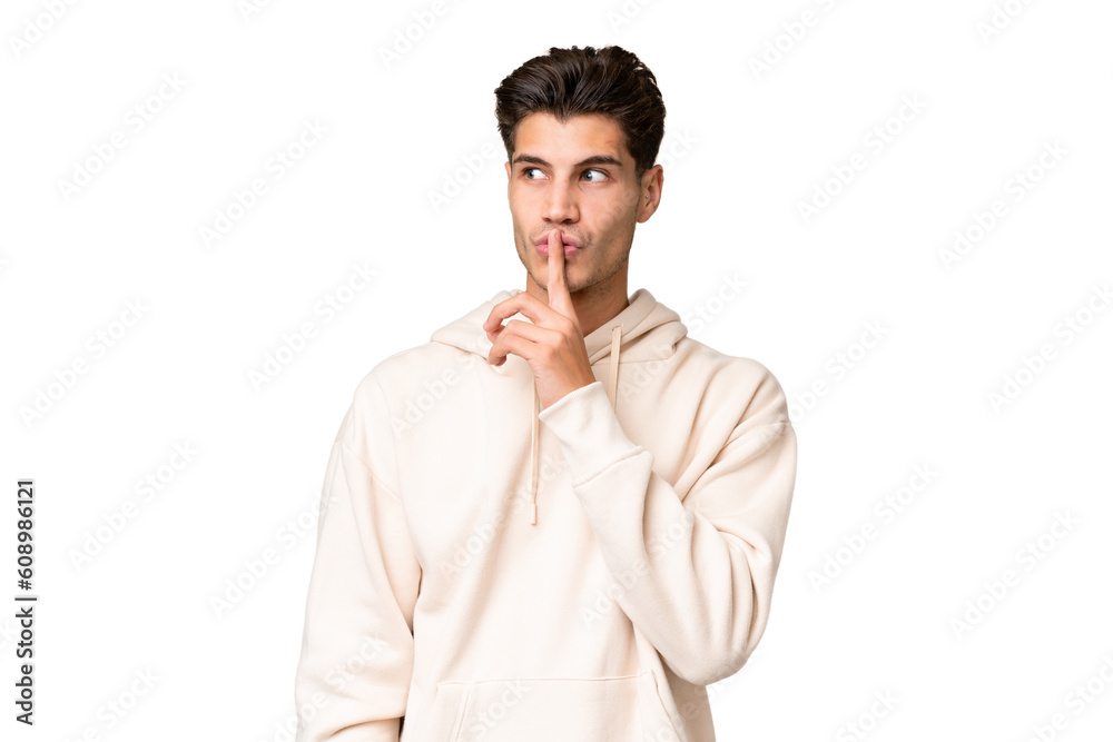 Young caucasian handsome man over isolated background showing a sign of silence gesture putting finger in mouth - obrazy, fototapety, plakaty 