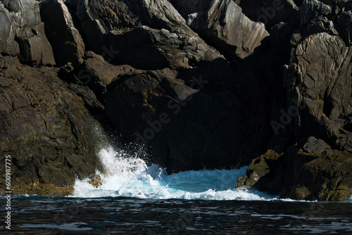 norway on the fjord, spray on rocks. Water splashes on the stones. Coastal landscape