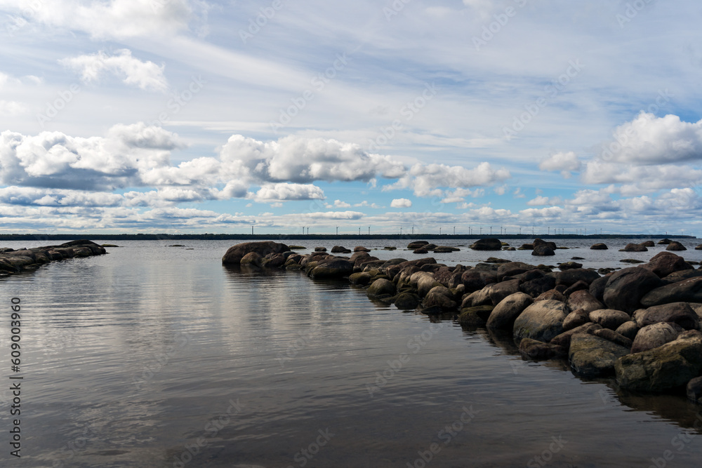 Seascape, rocky shore of the Baltic Sea in Estonia and a beautiful sky with clouds.