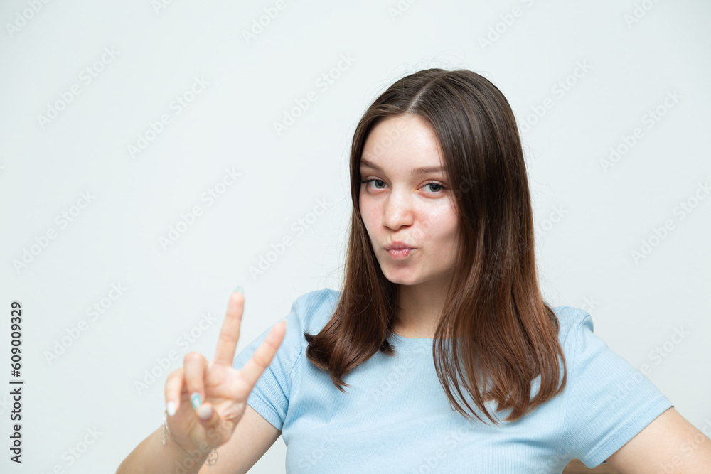 Confident caucasian girl posing and looking at the camera. Confident caucasian girl posing and looking at the camera.