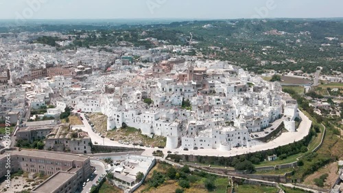 Panoramic view of the whole city of Ostuni in the Puglia region of Italy. White city drone view