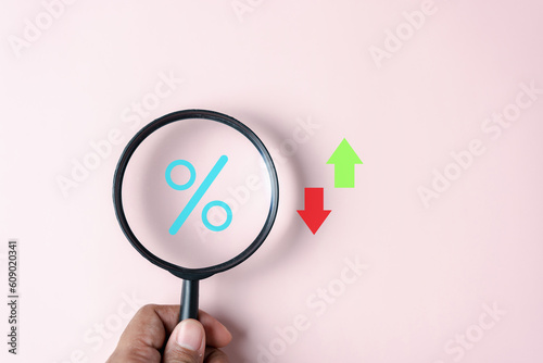 Magnifier focus to percentage icon inside for Increasing and decreasing, Up and Down arrow Currency money trading exchange transfer rate.