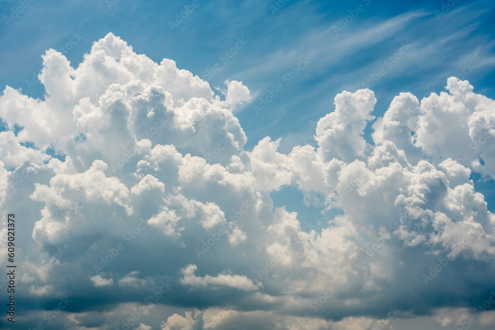 cumulus and cumulonimbus clouds, huge clouds that look like cotton in a blue sky cumulus and cumulonimbus clouds, huge clouds that look like cotton in a blue sky