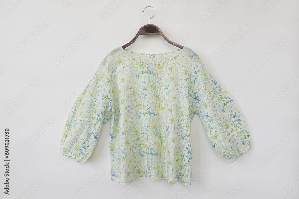 Obraz premium Woman blouse with summer blouse cotton on white background.