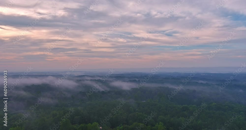 Veil early morning mist adds an element mystery to serene forest towering mountains Veil early morning mist adds an element mystery to serene forest towering mountains