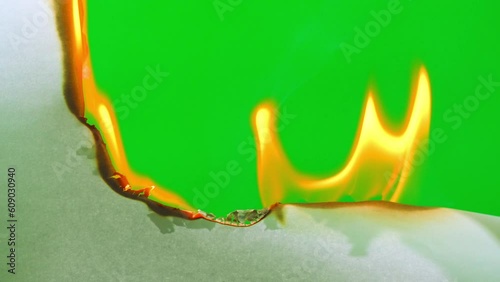 Fire flame burning paper on green screen background