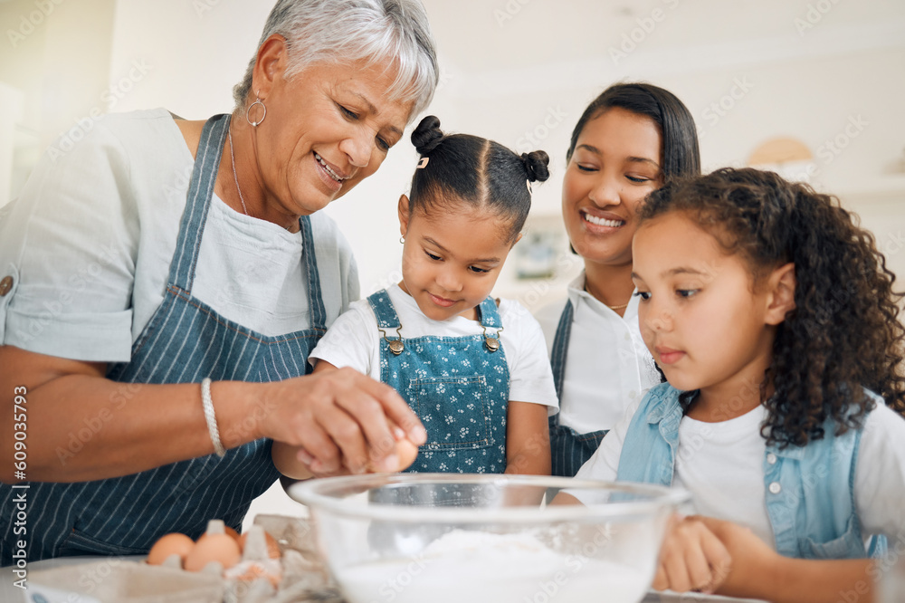 Grandmother teaching, mom or kids baking in kitchen as a happy family with young girl learning a recipe. Mixing cake, parent or grandma smiling or helping children to bake with eggs for development
