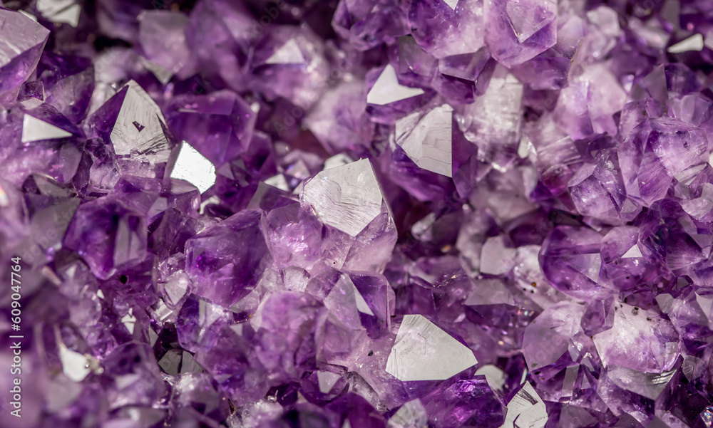 Amethyst pink crystals. Gems. Mineral crystals in the natural environment.  Texture of precious and semiprecious stones. Seamless background with copy  space colored shiny surface of precious stones. Stock Photo