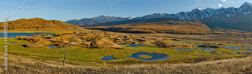 Russia. The South of Western Siberia, the Altai Mountains. View of Lake Dzhangyskol, lost in the Kurai steppe, with swampy marshy shores at the foot of the North Chui mountain range. photo