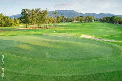 Fototapeta Naklejka Na Ścianę i Meble -  beautiful golf course view, Golf Course with beautiful putting green, Fresh green grass on the golf course