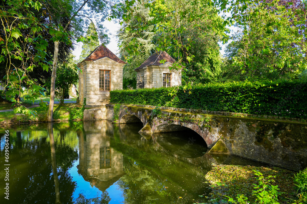 Ancient bridge spanning the Grand Morin river in the Parc des Capucins (