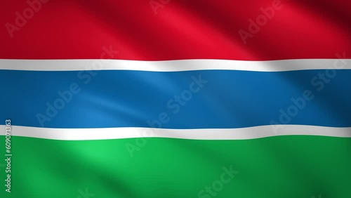 The Gambia flag waving in the wind photo