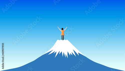 A back view of a man standing on top of a mountain with his arms raised to the sky. goal achievement concept.