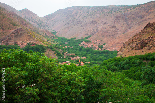 view of a canyon with village in the valley 