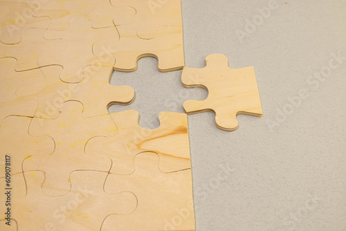 Puzzle jigsaw on orange background. business concept
