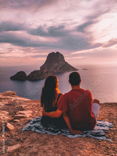 couple sitting in es vedra watching the sunset