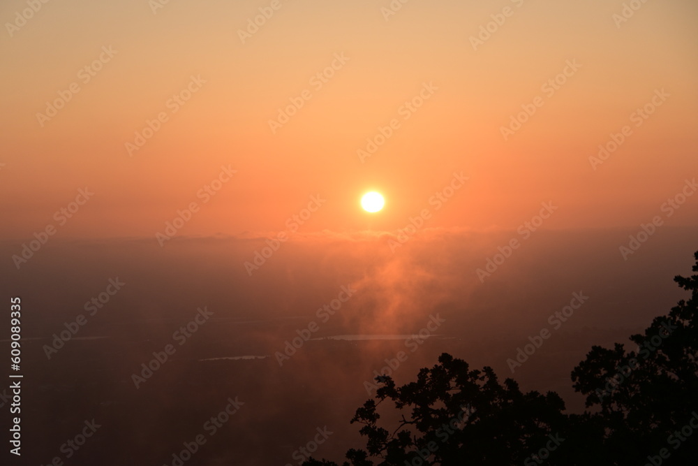 sunrise over the morning mist