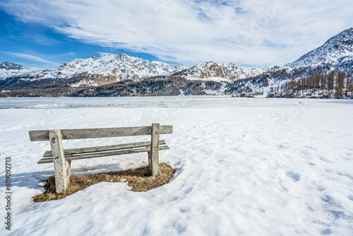 Winter scene at Resia Lake  with sunken gray steeple. Resia Lake is an artificial lake located in the western portion of South Tyrol, Italy, near the Resia Pass.