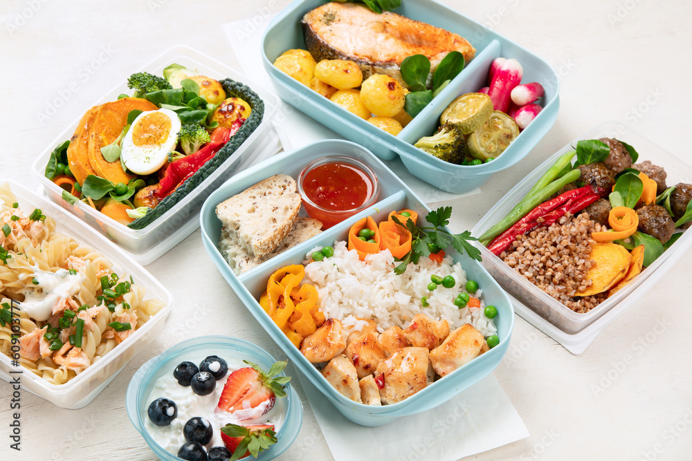 Restaurant healthy food delivery in take away boxes for daily nutrition on white background.