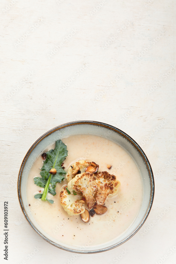 Roasted cauliflower soup served with grilled bread. Roasted cauliflower soup served with grilled bread.