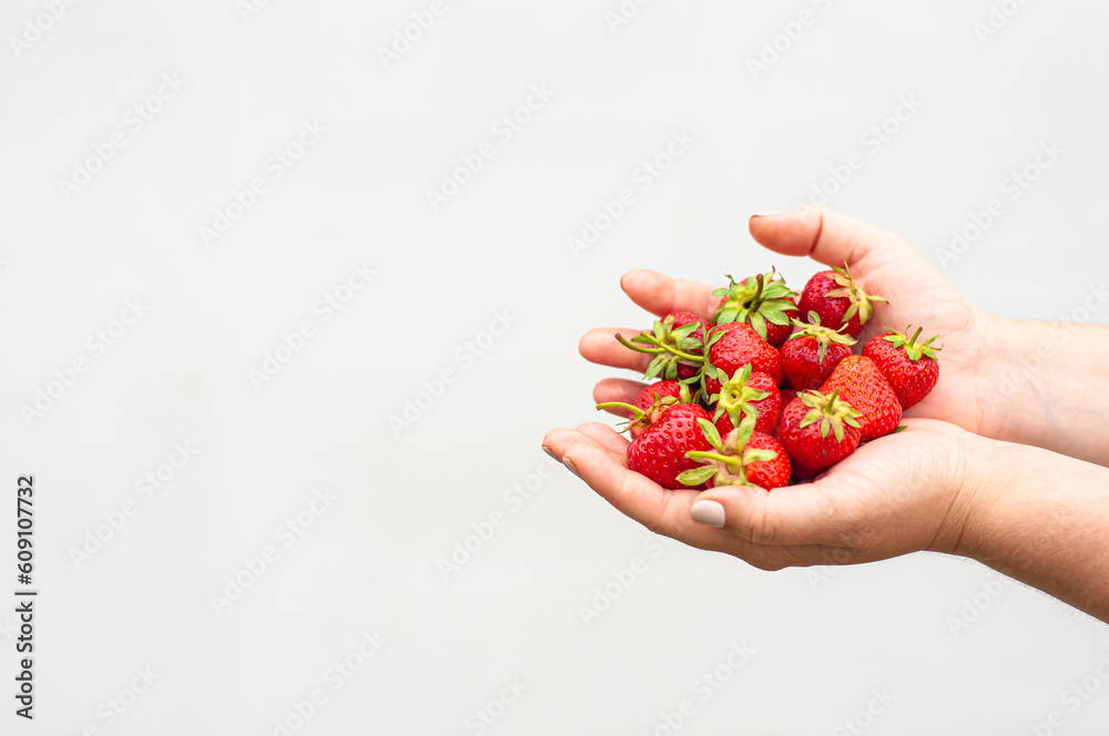 sweet red strawberry in the hand on a white background, delicious berry, vitamins, diet, fruit, farm product, vegetarian sweet red strawberry in the hand on a white background, delicious berry, vitamins, diet, fruit, farm product, vegetarian