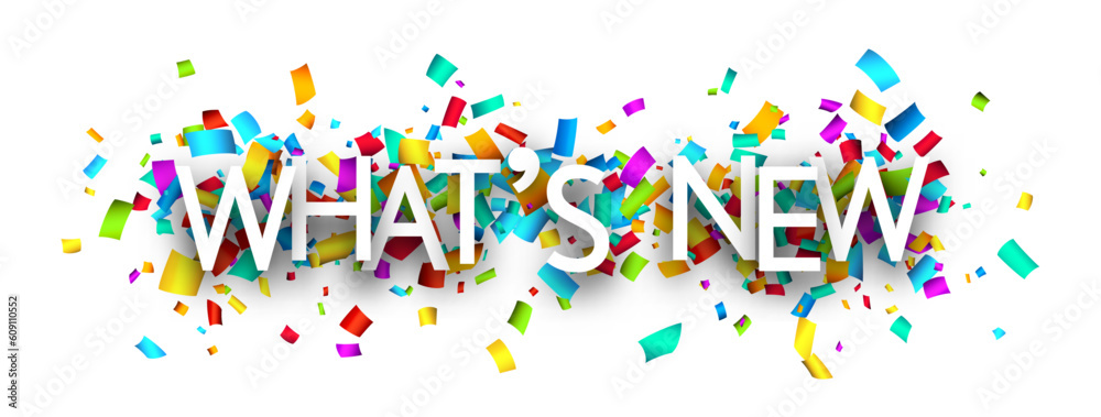 What's new sign over cut out ribbon confetti background. What's new sign over cut out ribbon confetti background.