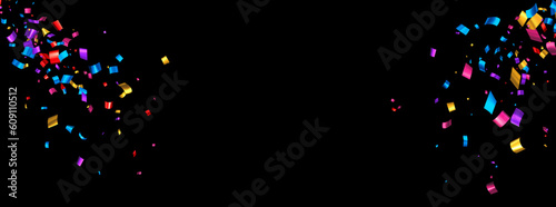 Colorful cut out ribbon exploding confetti on black background.